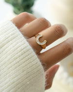 Gold horseshoe ring from Sami Jewels, featuring a sleek jewelry design with a polished finish.