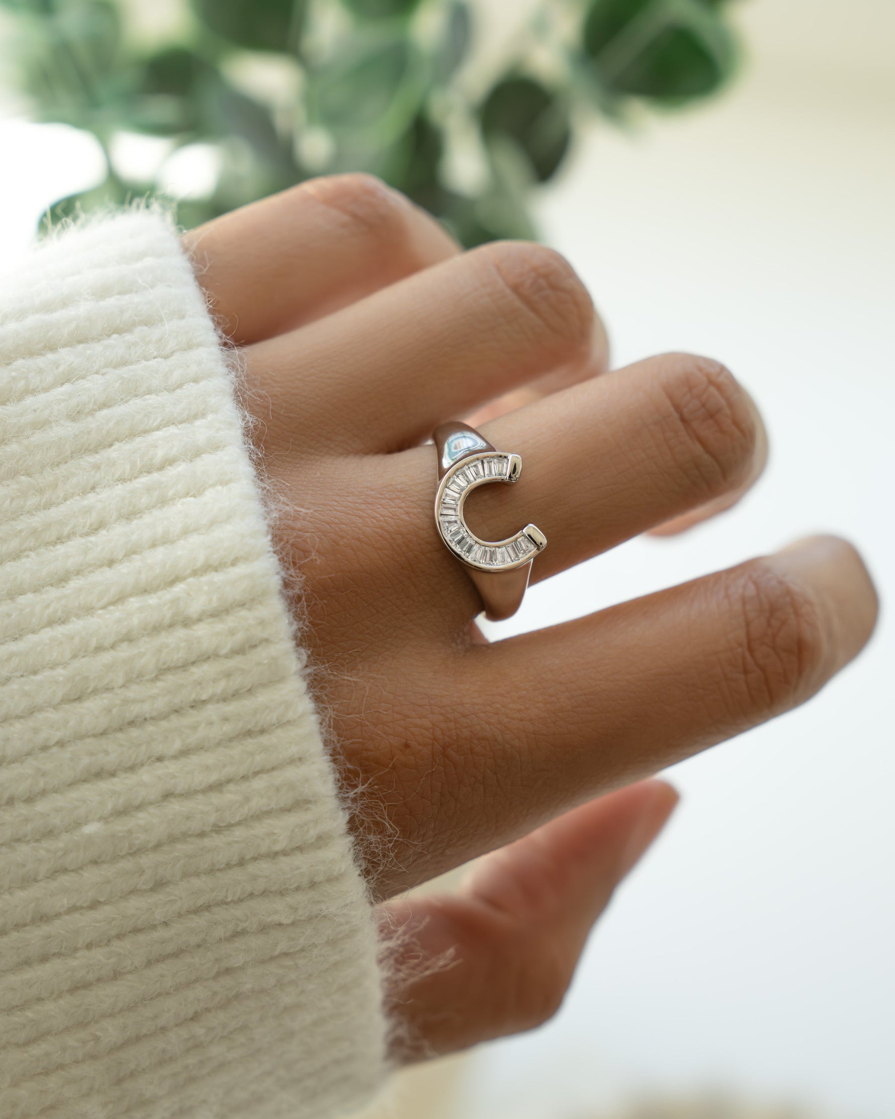 Sterling silver horseshoe-shaped ring from Sami Jewels jewelry collection, featuring a detailed horseshoe design.
