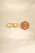 Gold minimalist huggie hoop earrings by Sami Jewels, side profile showing sleek, simple design for everyday wear.