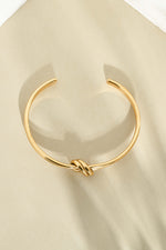 Gold stainless steel SS knotted bangle bracelet by Sami Jewels with a sleek, waterproof design and modern knot detail.