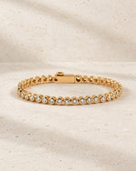 Lab-grown diamond round bezel tennis bracelet in gold vermeil with the clasp closed