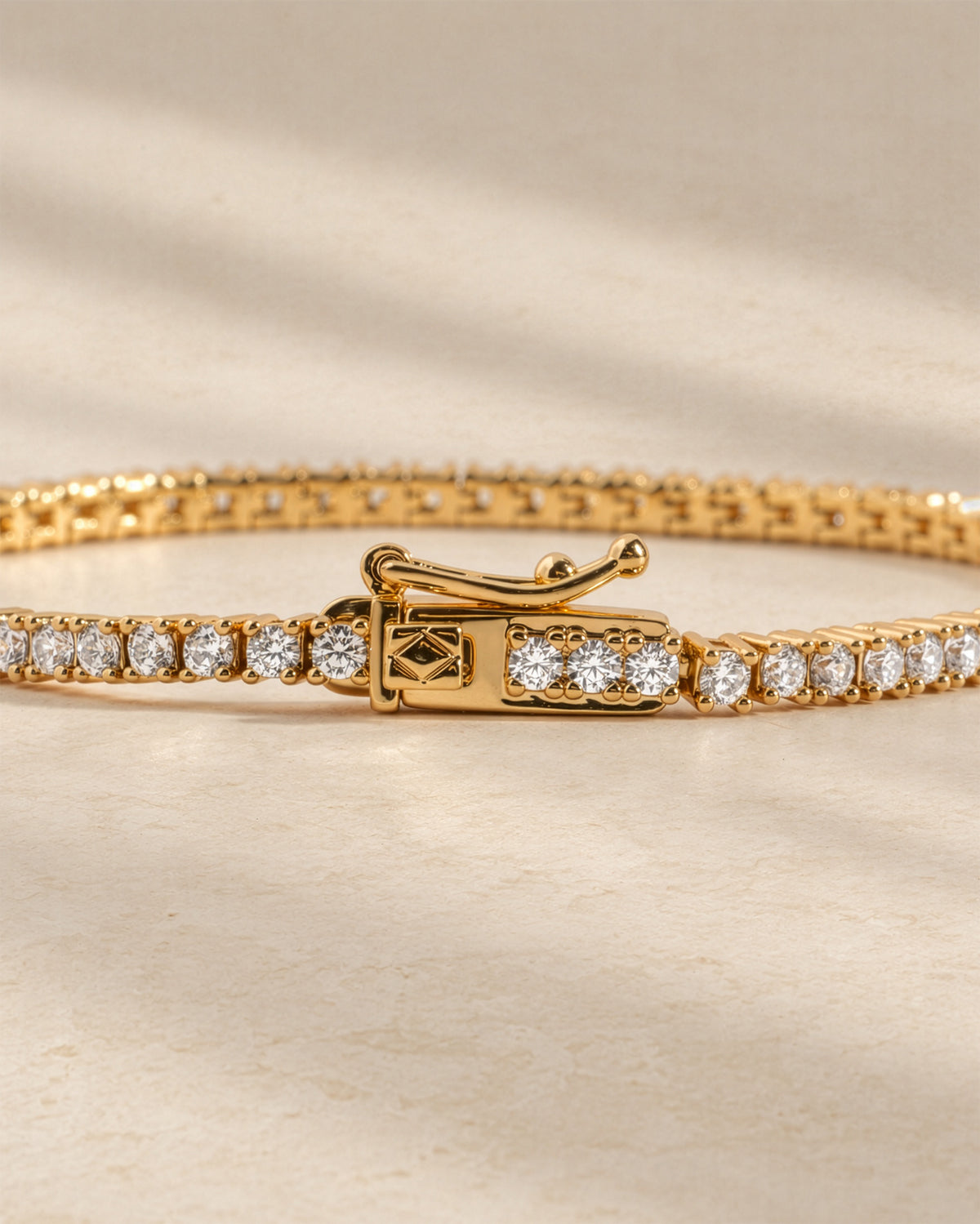 Lab-grown diamond tennis bracelet showing the box clasp with safety latch