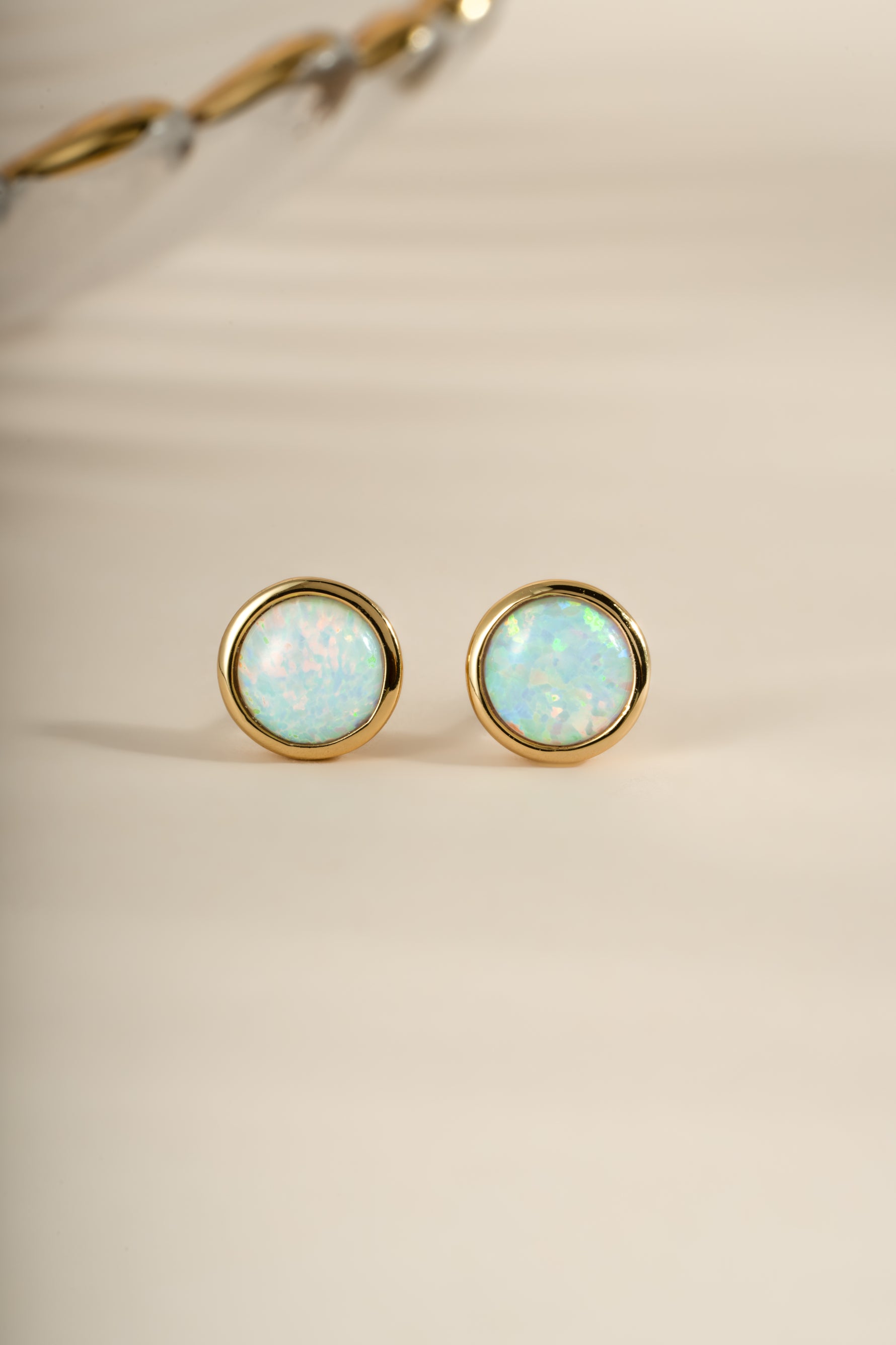 Gold large opal stud earrings by Sami Jewels featuring vibrant, round opal gemstones set in elegant gold settings.
