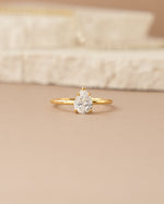 Gold Large Pear Statement Ring by Sami Jewels featuring a prominent pear-shaped design, front view showcasing elegant craftsmanship.
