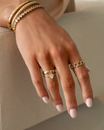 Gold Large Pear Statement Ring by Sami Jewels displayed on a model, showcasing its bold pear-shaped design and intricate details.