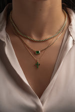 Layered necklace look with the round emerald tennis necklace