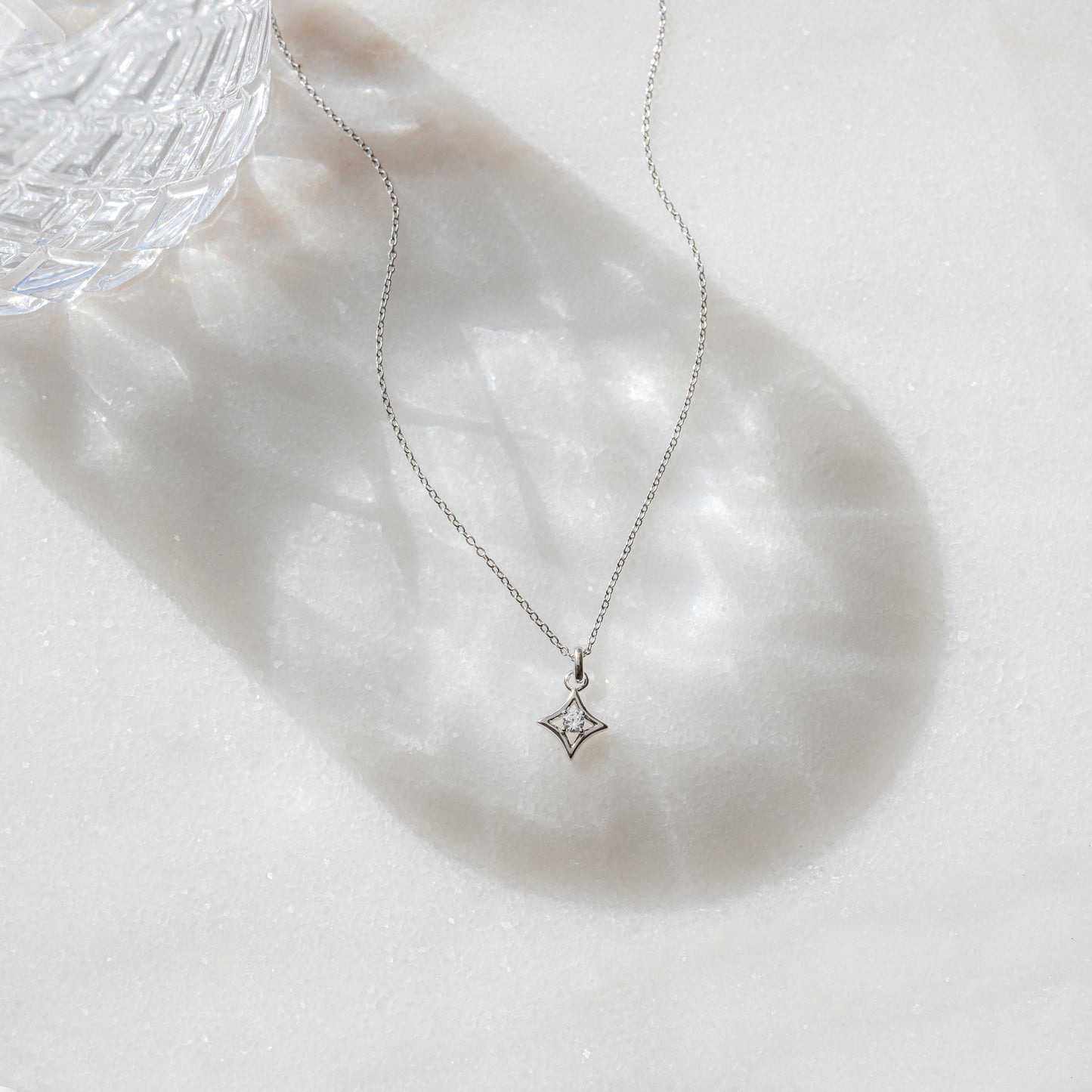 minimalist silver necklace with diamond pendant