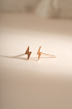 Rose gold lightning bolt stud earrings by Sami Jewels, featuring bold, modern jewelry design with a sleek lightning bolt shape.