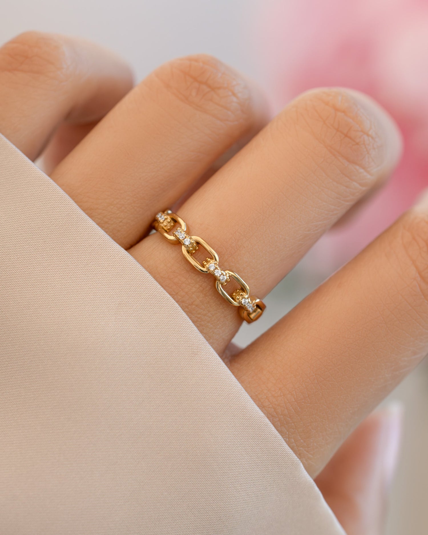 Gold Link Chain Ring by Sami Jewels worn on model, showcasing a stylish chain-link design in close-up view.
