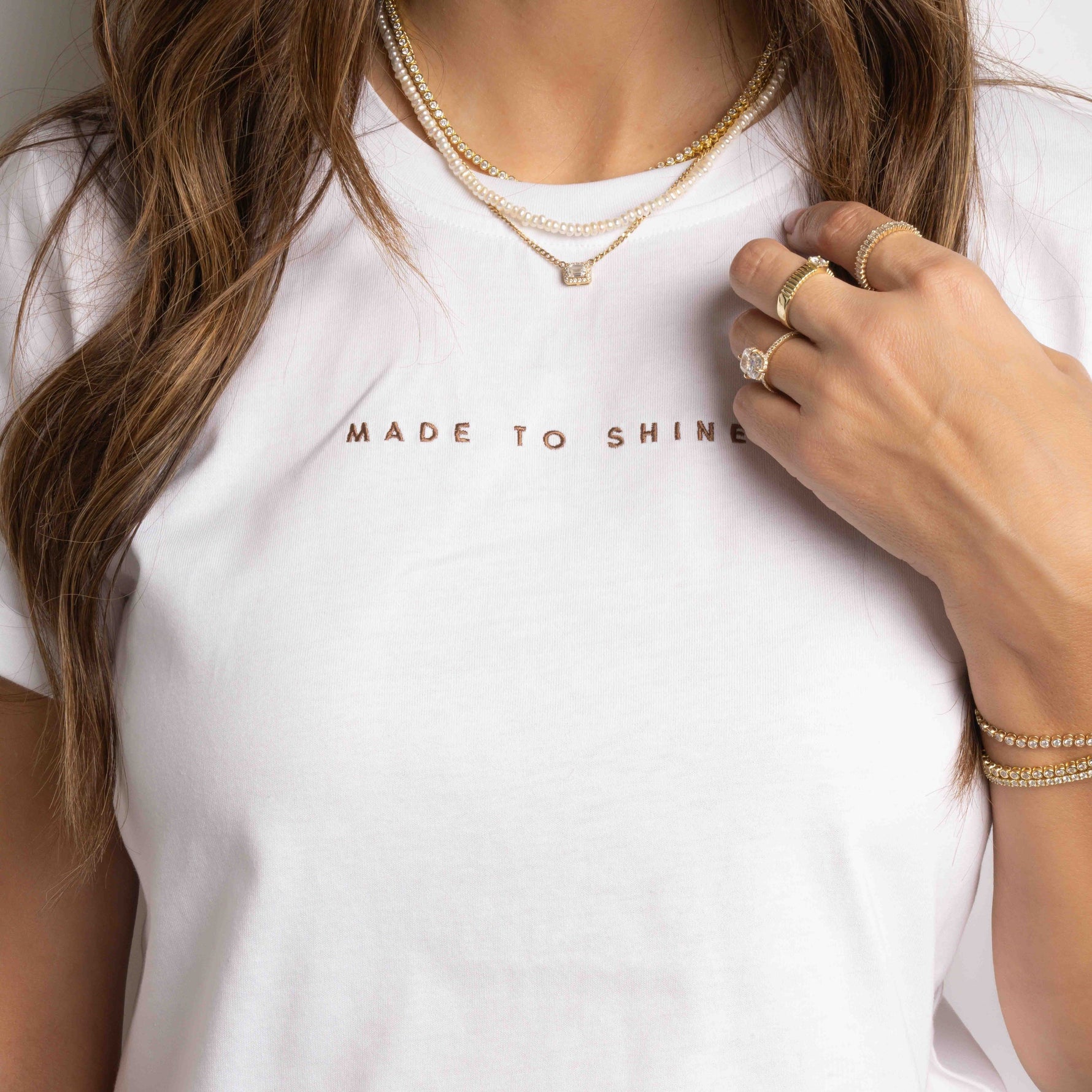 model wearing "Made To Shine" white tee