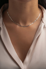 Gold mariner chain necklace on model with a crew neck top
