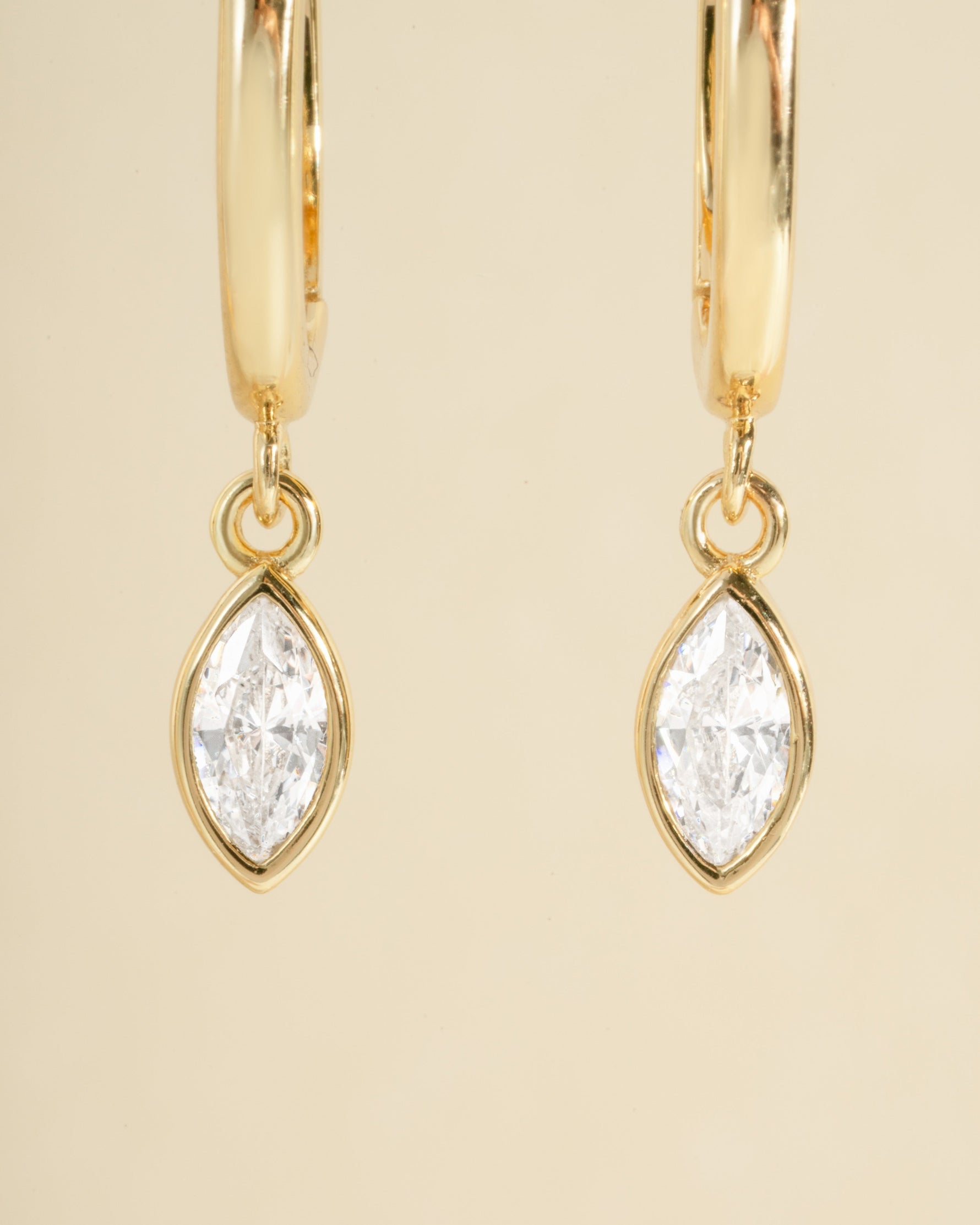 Sami Jewels marquise bezel drop huggie earrings with gold hoops and elegant marquise-shaped design, close-up view.