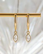 Gold Marquise Bezel Drop Huggie Earrings with stone detail from Sami Jewels, featuring elegant hoop design and sparkling accents.