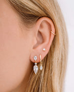 Gold Marquise Bezel Drop Huggie Earrings by Sami Jewels worn on a model, featuring elegant marquise-shaped design and hoop style.