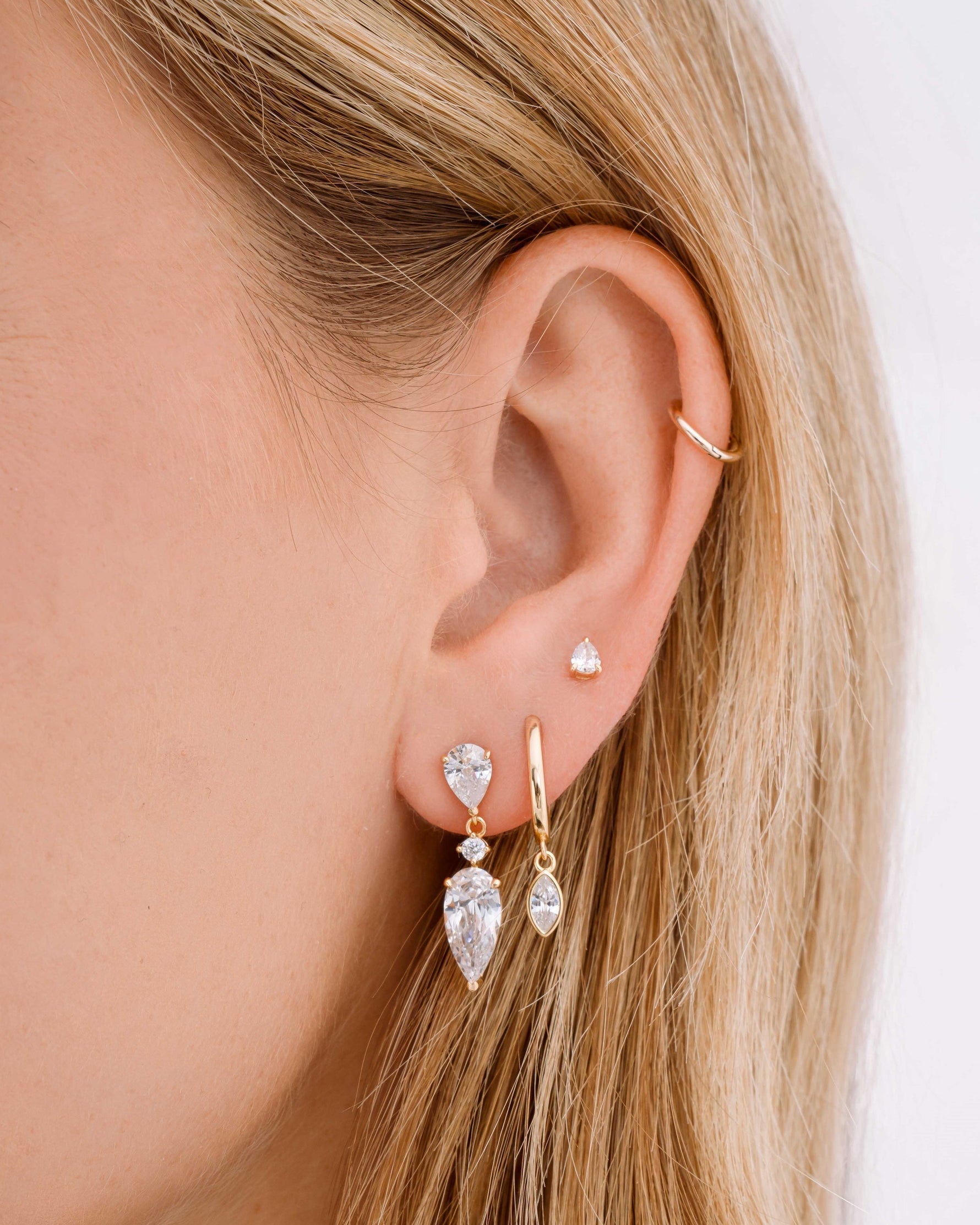 Gold Marquise Bezel Drop Huggie Earrings by Sami Jewels worn on a model, featuring elegant marquise-shaped design and hoop style.