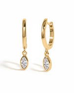 Gold marquise bezel drop hugger earrings by Sami Jewels, featuring elegant hoop design on a white background.