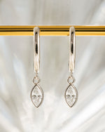 Sterling silver Marquise Bezel Drop Huggies earrings featuring bezel-set marquise-shaped stones and hoop design.