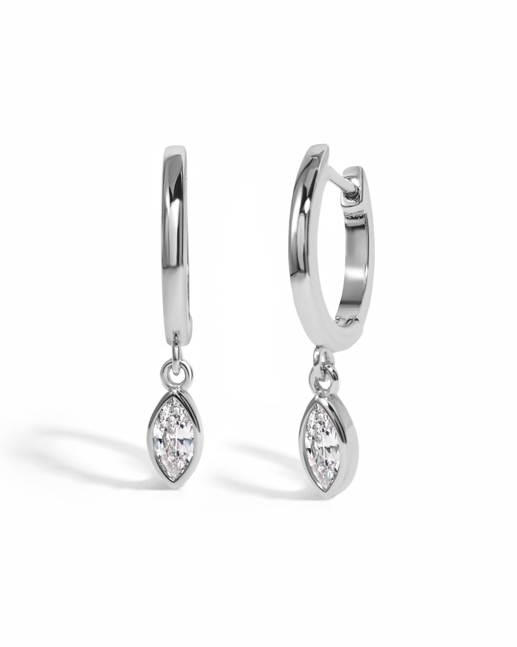 Sterling silver Marquise Bezel Drop Huggie Earrings by Sami Jewels, featuring elegant marquise-shaped design on a white background.