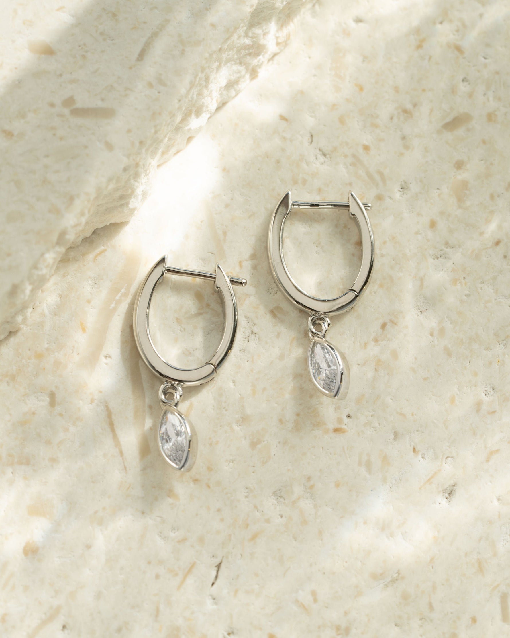 Sterling silver Marquise Bezel Drop Huggies earrings with elegant marquise-shaped design and bezel setting from Sami Jewels.