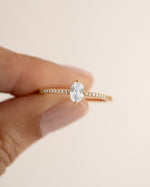 Close-up of Sami Jewels Maddy ring featuring a marquise-shaped cubic zirconia and pave gold band.