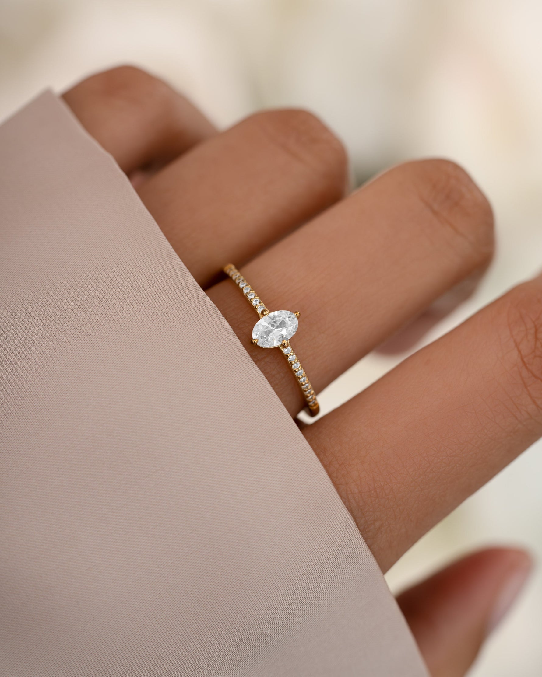 Gold Maddy ring by Sami Jewels featuring a marquise-shaped cubic zirconia and pave band design.