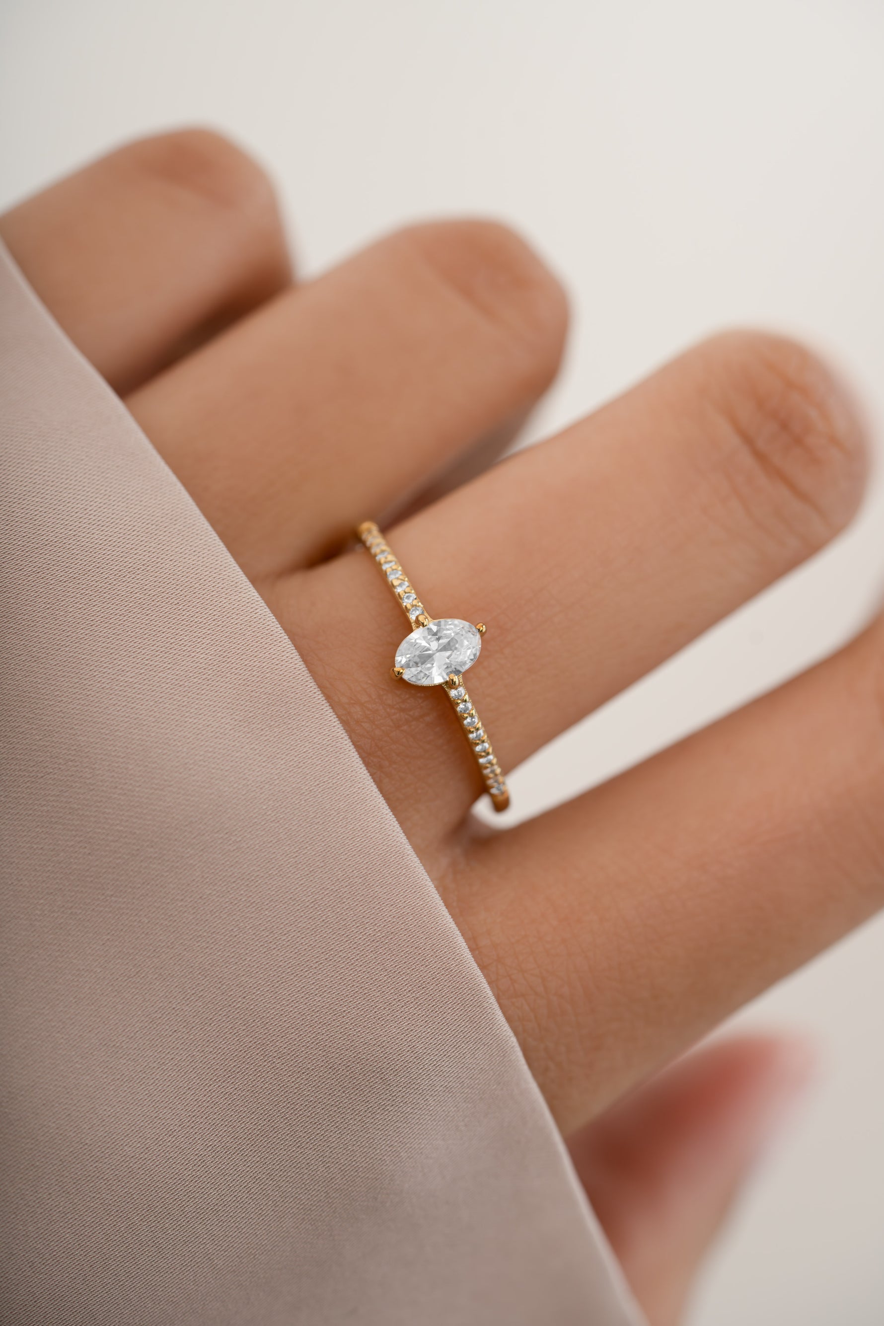 Sami Jewels Maddy Ring with marquise-shaped cubic zirconia and pave gold band worn on finger.