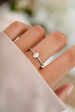 Sami Jewels Maddy Ring featuring a marquise-shaped CZ stone and pave band in sterling silver on a model.