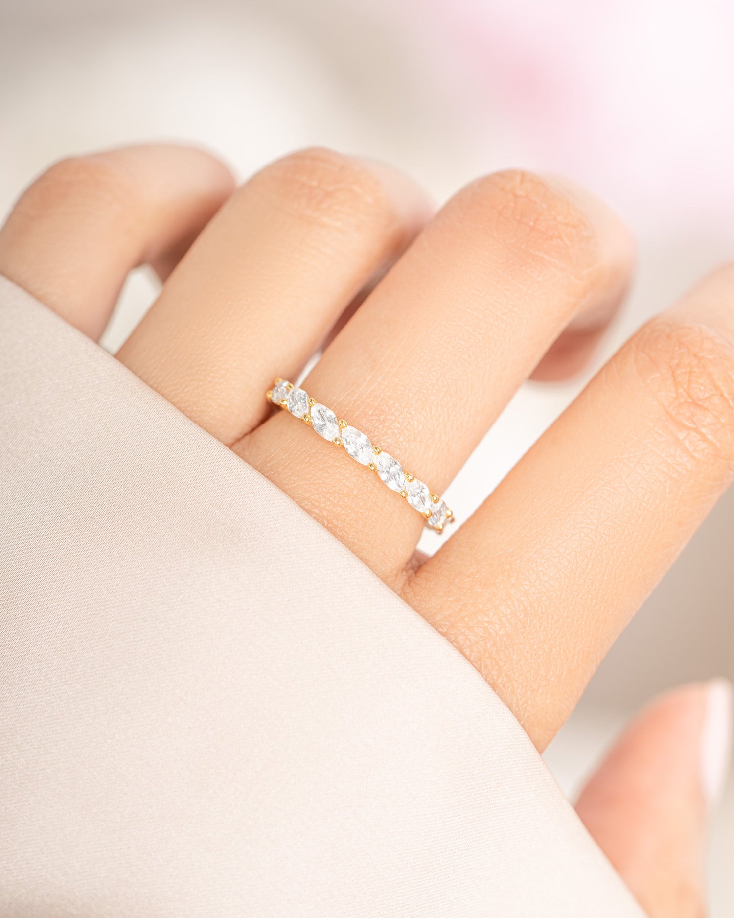 Gold Marquise Eternity Ring by Sami Jewels featuring a continuous row of marquise-cut gemstones on a sleek band.