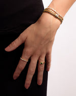 Gold Sami Jewels marquise eternity ring stacked design featuring sparkling stones and elegant craftsmanship.