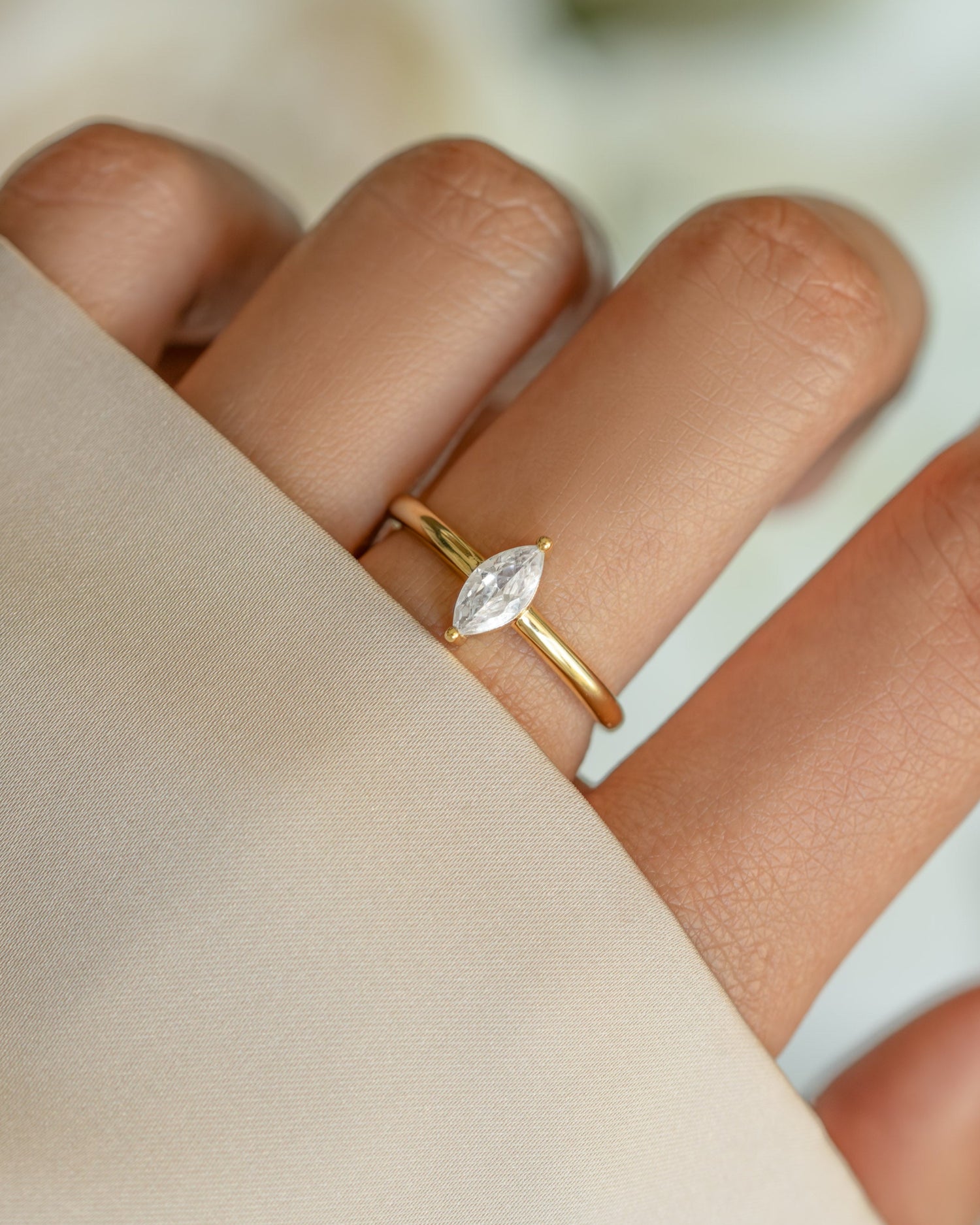 Gold Solitaire Marquise Ring by Sami Jewels featuring a marquise-cut gemstone set in a sleek gold band.