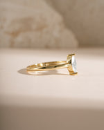 Gold solitaire marquise ring by Sami Jewels, side view displaying its elegant marquise-shaped gemstone and sleek band.