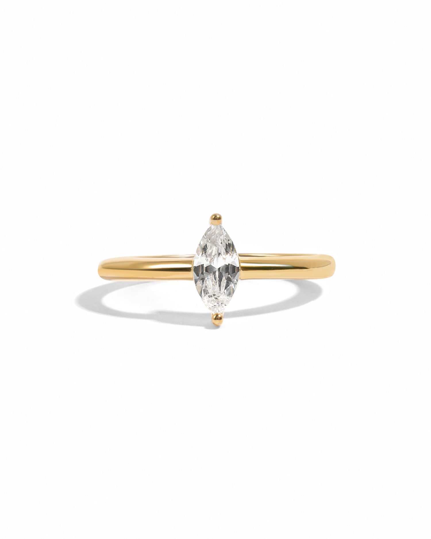 Gold Solitaire Marquise Ring by Sami Jewels featuring a prominent marquise-cut gemstone on a sleek band.