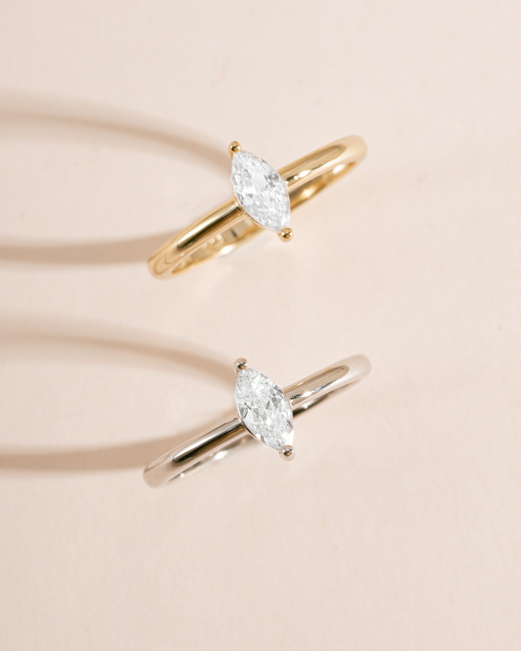 Sterling silver and gold solitaire marquise ring by Sami Jewels featuring a marquise-shaped gemstone.