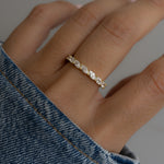 Worn solo by the model,  this eternity ring makes a refined statement, effortlessly blending with casual looks. 