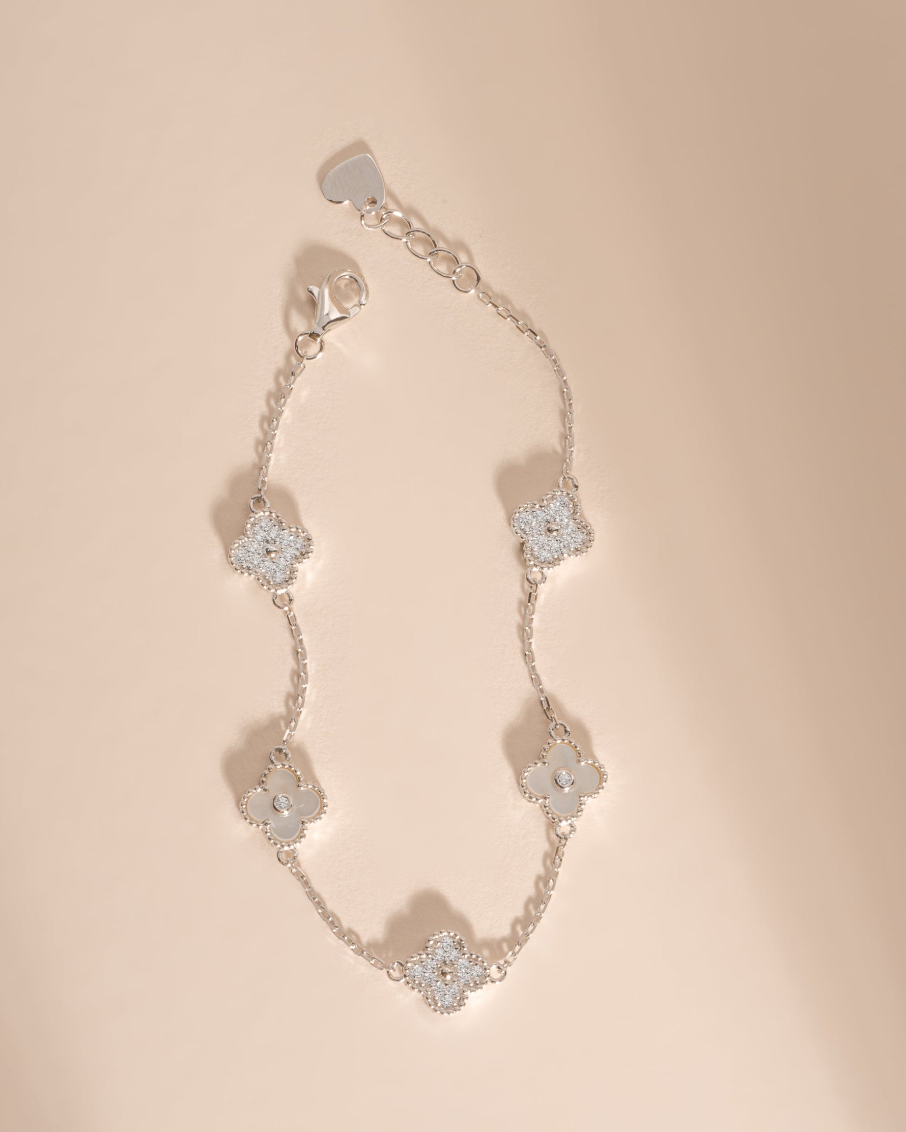 Silver MOP and diamond four-leaf clover bracelet by Sami Jewels with an adjustable chain, minimalist design.