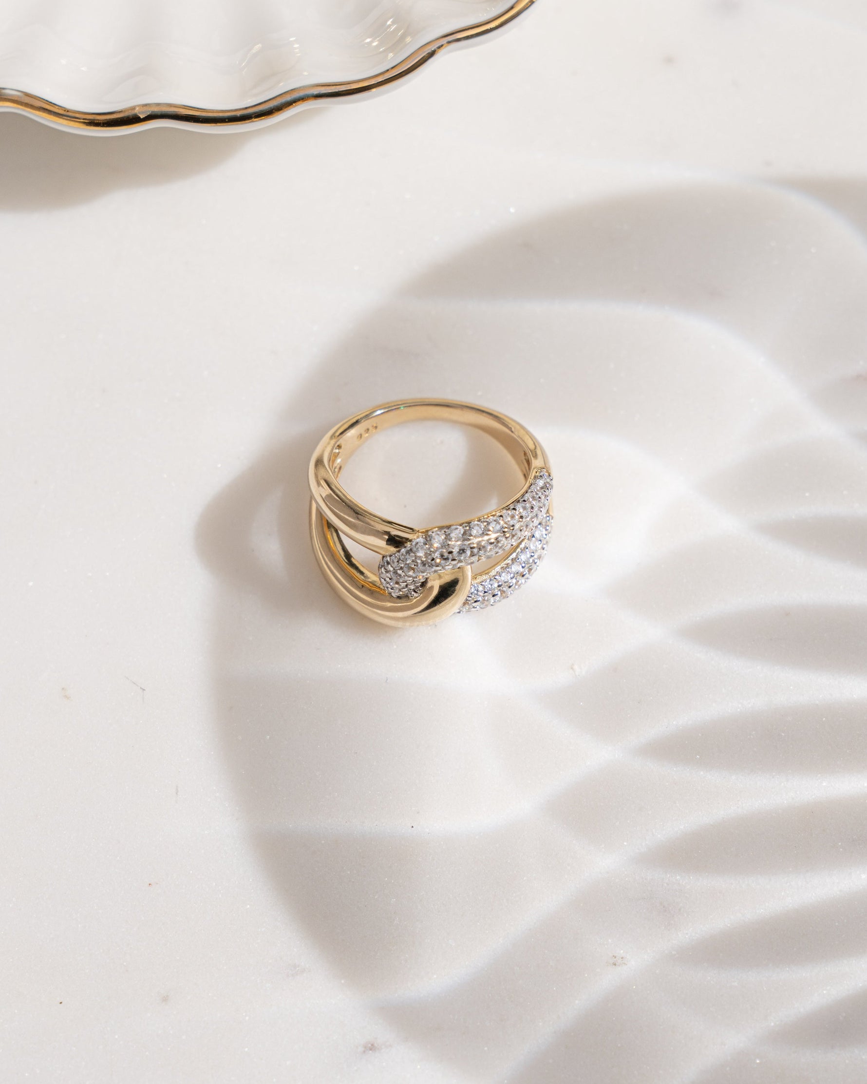 Mixed metal loop ring featuring gold and sterling silver elements, crafted by Sami Jewels, showcasing a modern, intertwined design.
