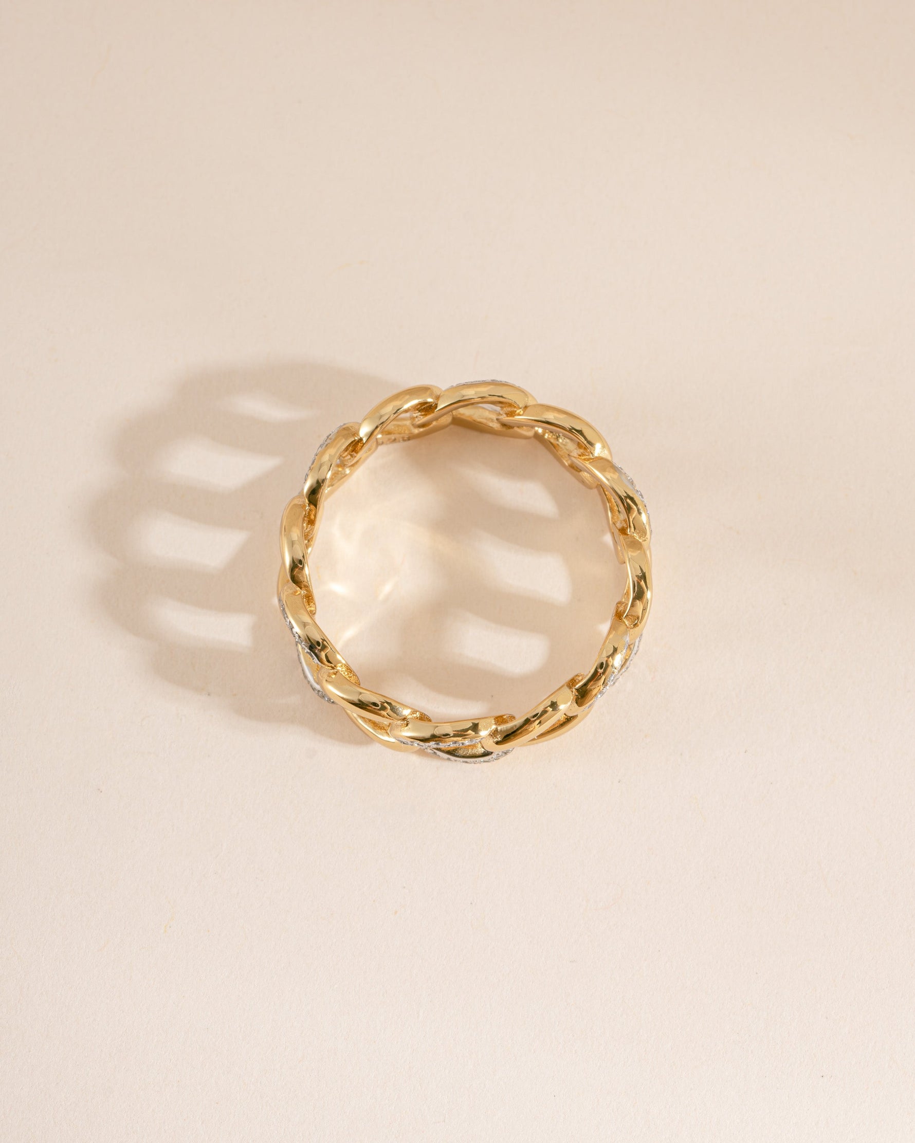 Top view of Sami Jewels mixed metal pavé chain ring showcasing intricate metalwork and sparkling pavé design.