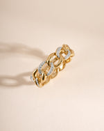 Sami Jewels mixed metal pavé chain ring showing a detailed design with shiny metal accents and intricate pavé setting.
