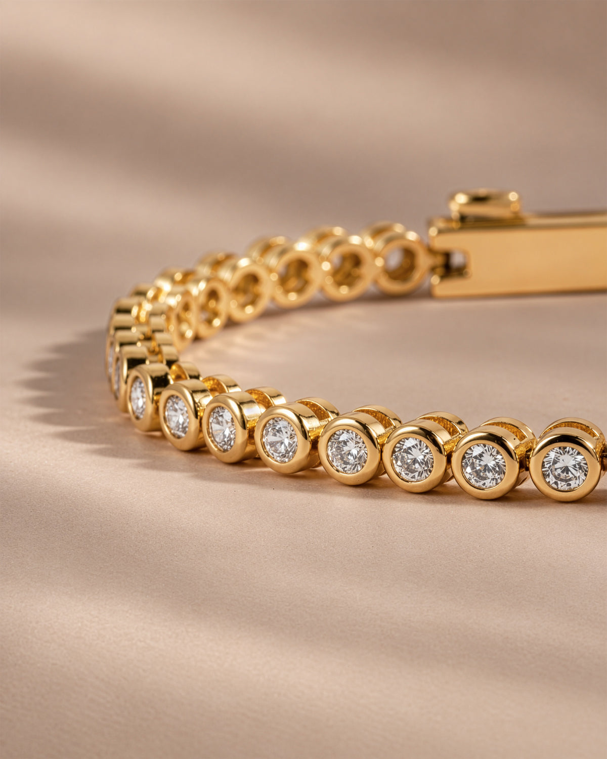Close-up of the round bezel settings on the moissanite tennis bracelet