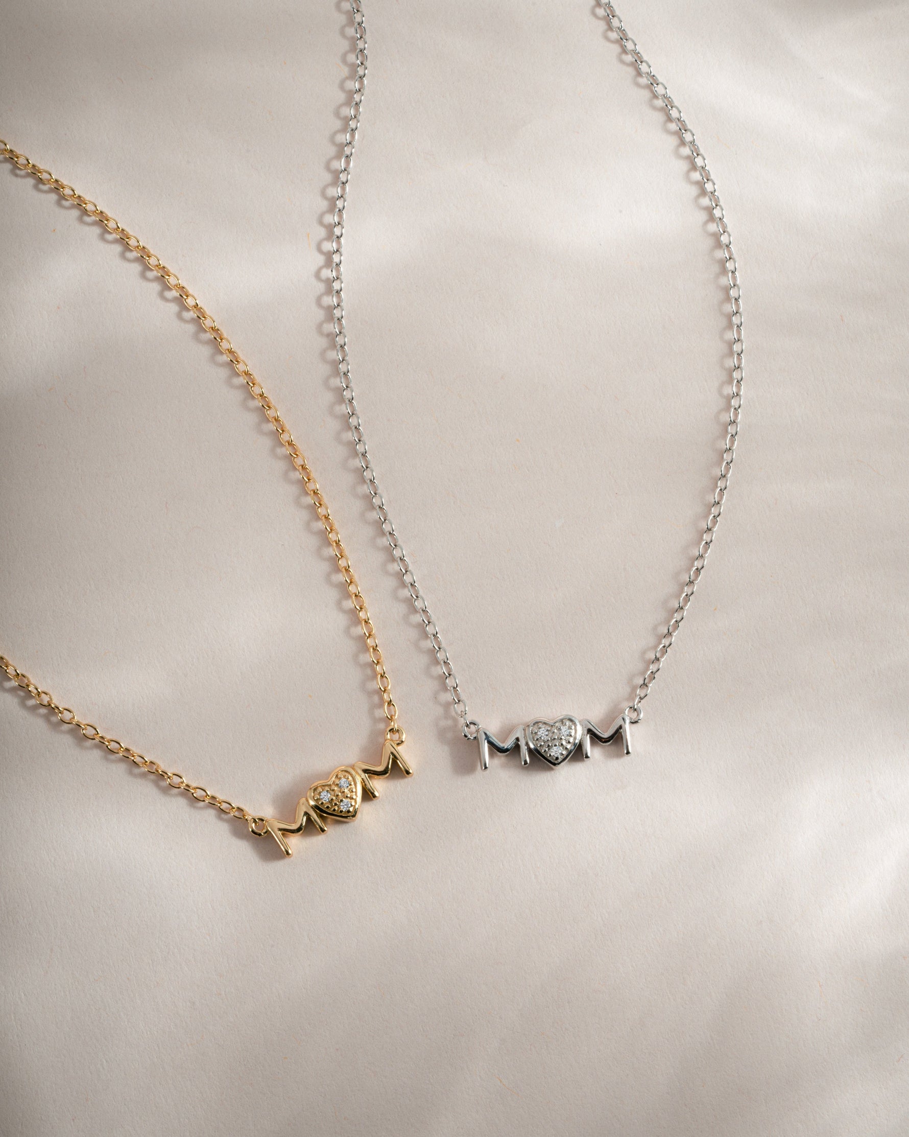 Gold and sterling silver Mom Heart Necklace from Sami Jewels featuring a delicate heart pendant.