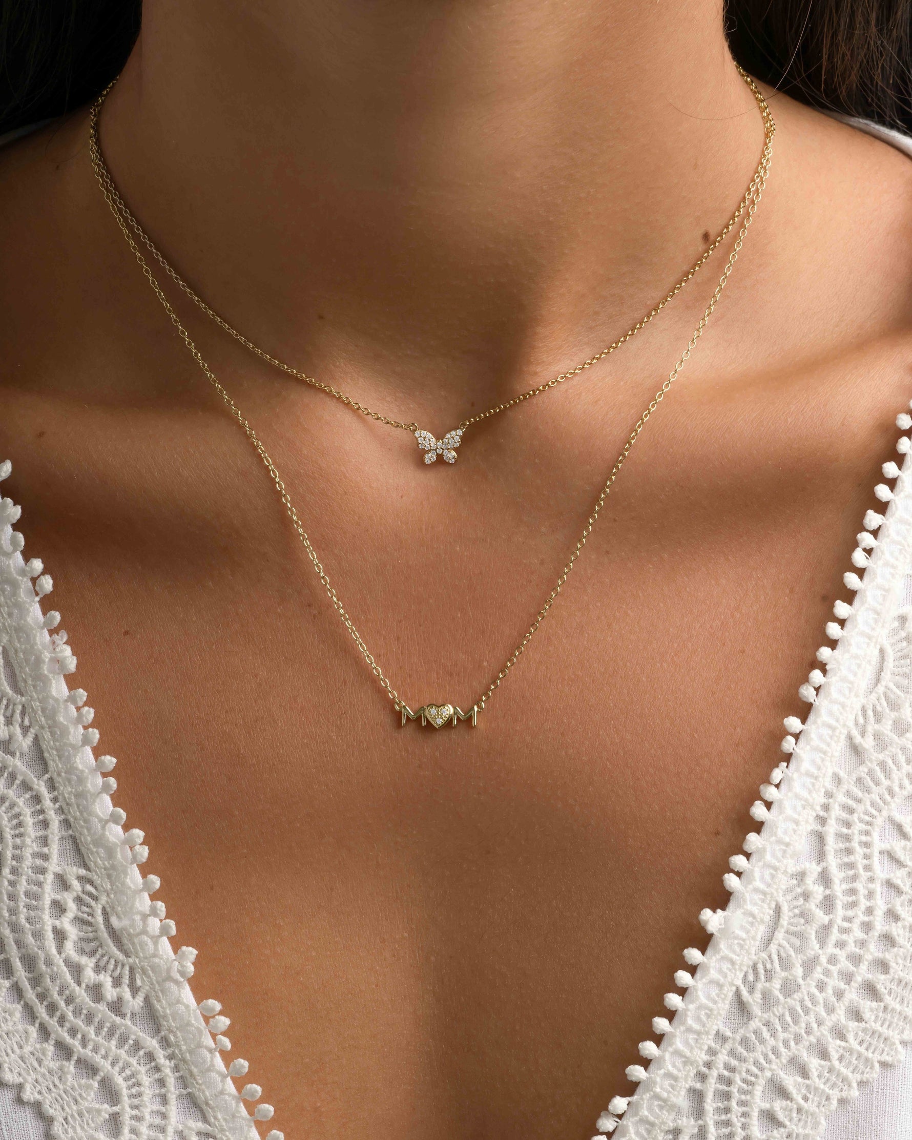 Gold Mom Heart Necklace by Sami Jewels styled on a model, featuring a delicate heart pendant symbolizing motherhood.