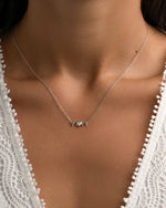 Sterling silver Mom Heart Necklace by Sami Jewels worn on a model, featuring a delicate heart pendant symbolizing maternal love.