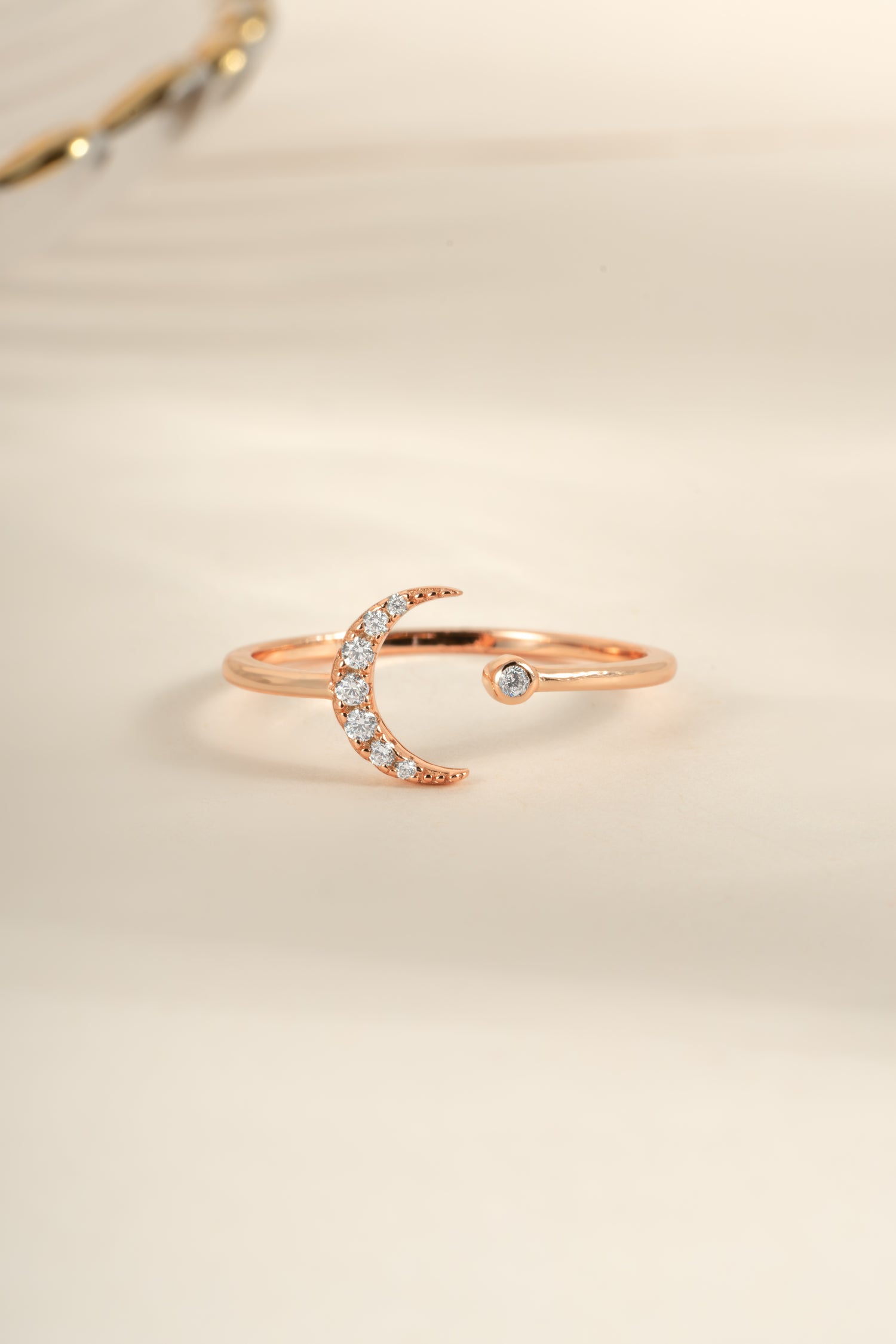 Rose gold moon ring from Sami Jewels featuring a sleek, minimalist design and a polished finish.