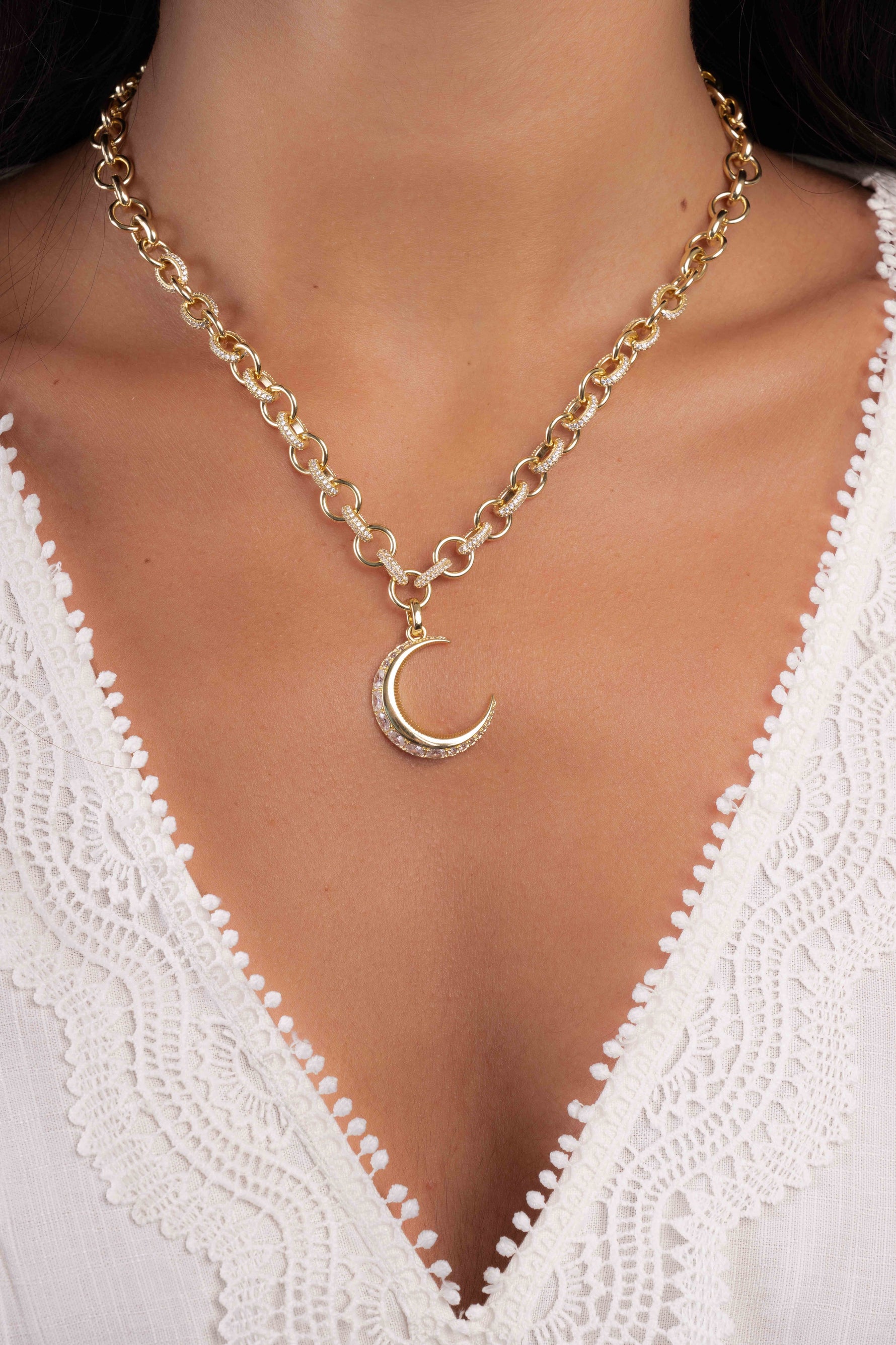 Gold Moon Statement Necklace by Sami Jewels displayed on a model, showcasing its elegant design and celestial-inspired style.