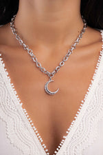 Silver Moon Statement Necklace from Sami Jewels featuring a bold moon design on a delicate chain.