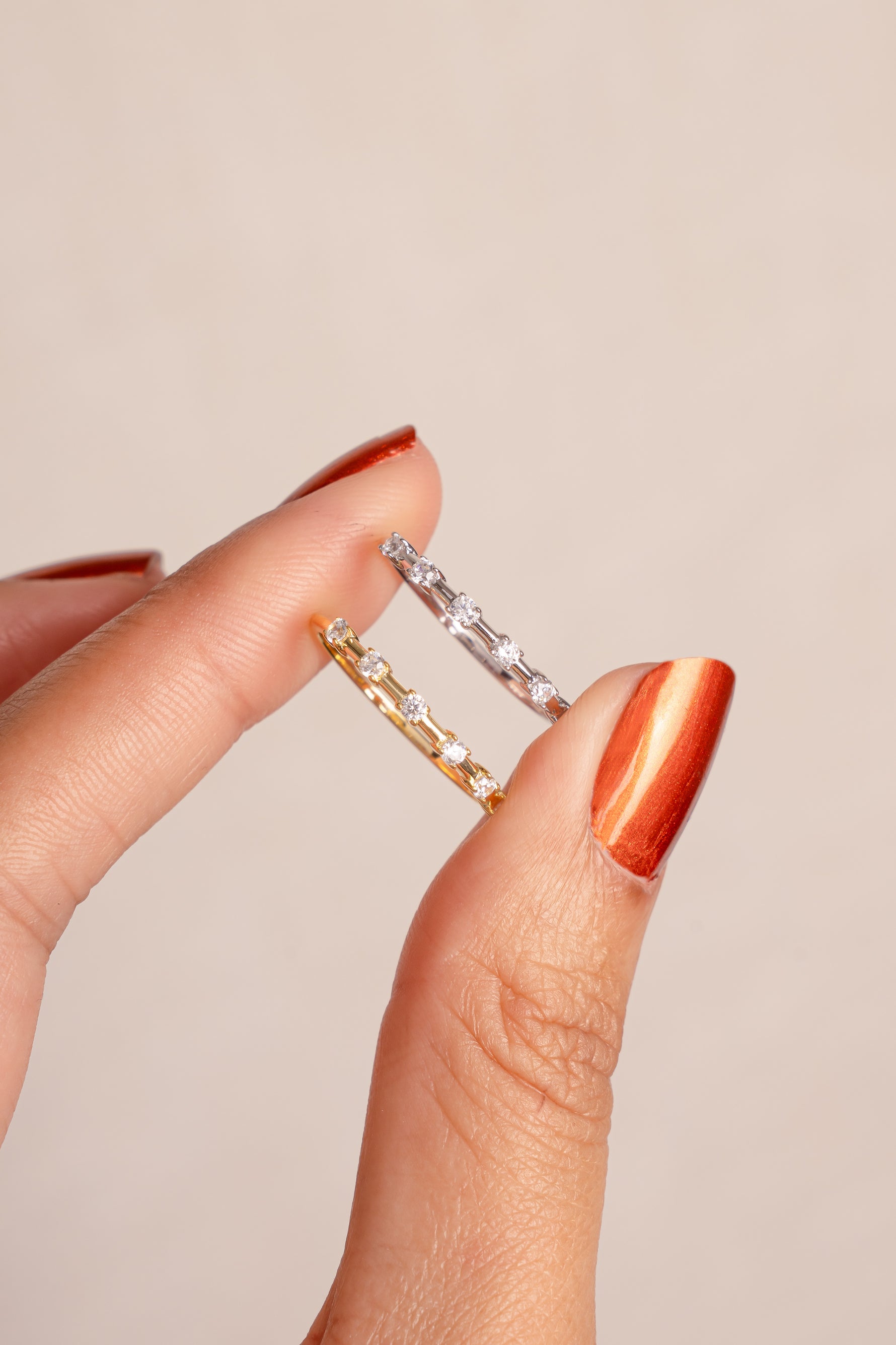Close-up of Sami Jewels multi-stone diamond ring featuring gold and sterling silver, showcasing sparkling gemstones and intricate design.