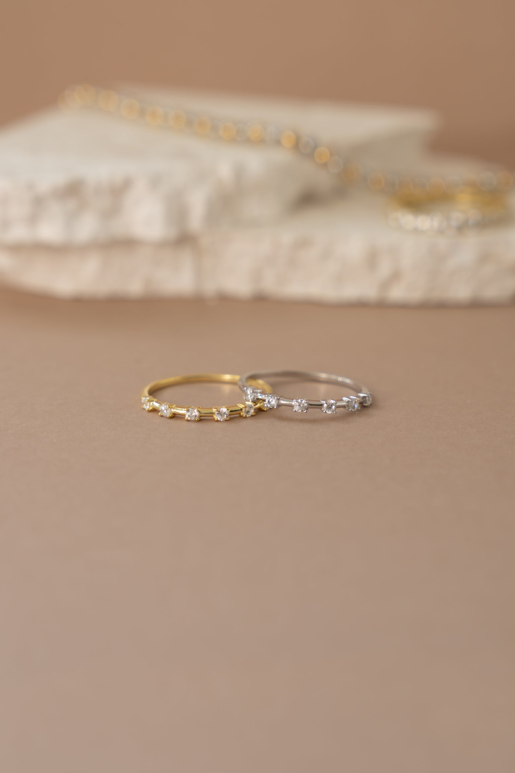 Multi-stone diamond ring by Sami Jewels featuring gold and sterling silver band with sparkling gemstones.