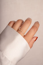 Sami Jewels multi-stone diamond ring with gold band, featuring multiple sparkling gemstones and intricate design details.