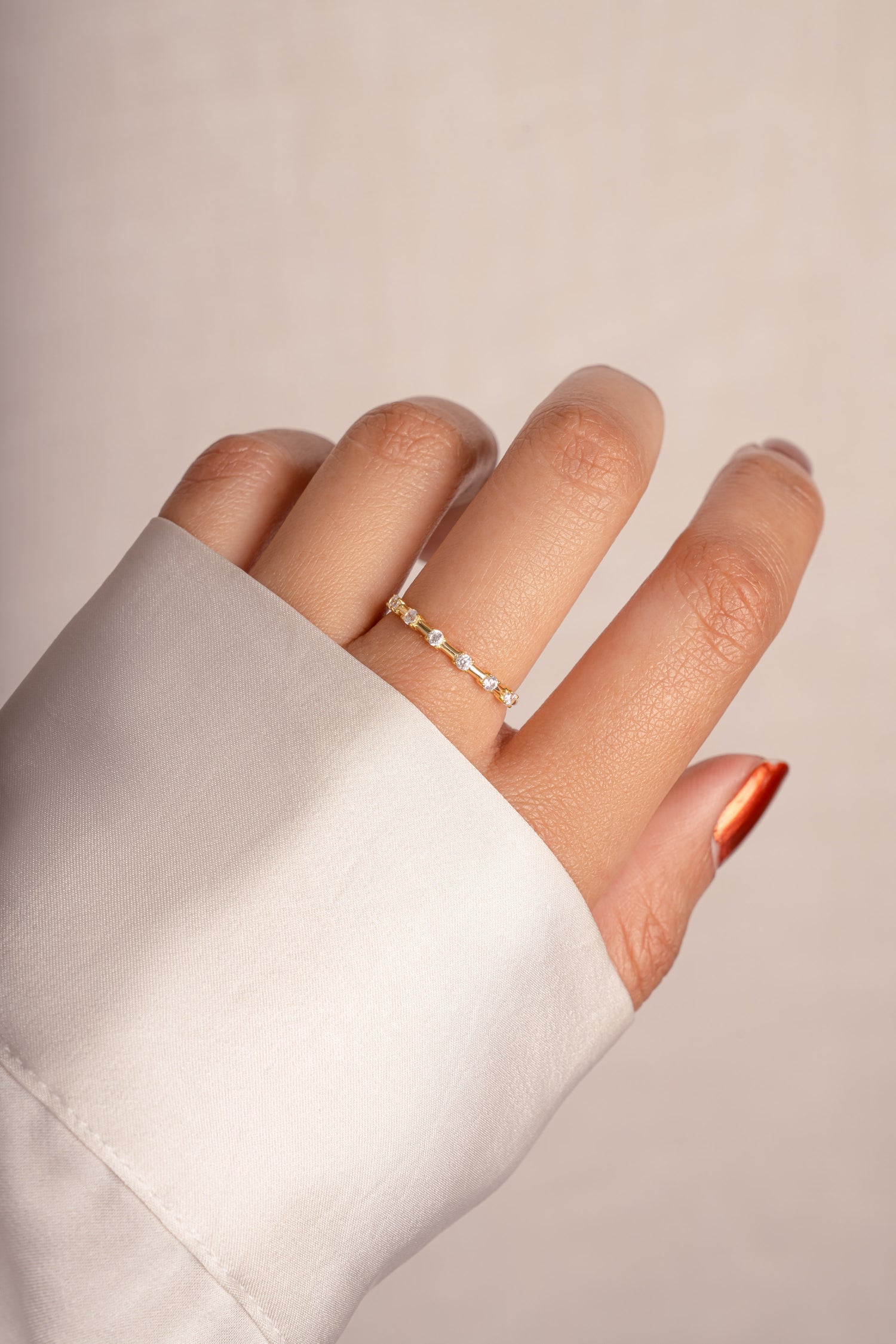 Sami Jewels multi-stone diamond ring with gold band, featuring multiple sparkling gemstones and intricate design details.
