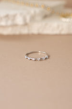 Sterling silver multi-stone diamond ring by Sami Jewels featuring a front view of sparkling multi-colored gemstones.